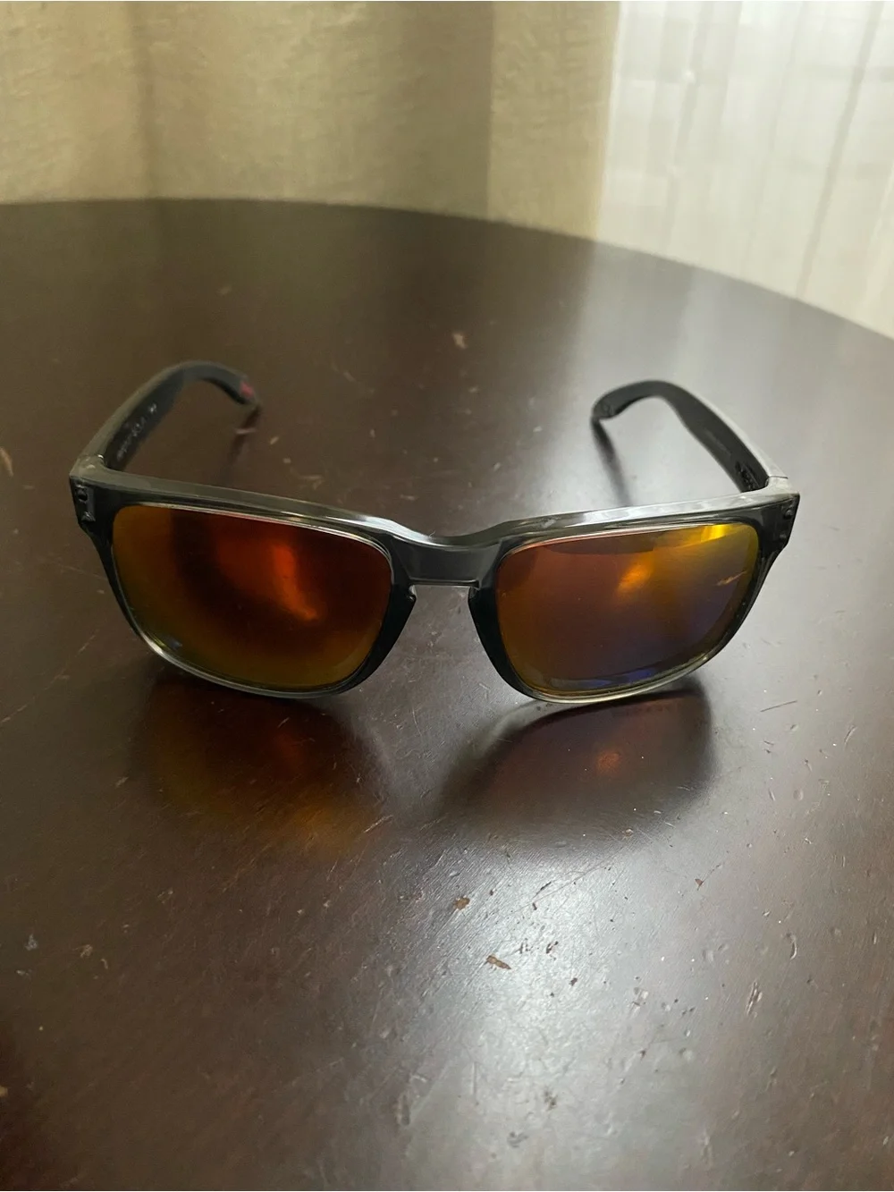 Oakley Smoky Black Frame Sunglasses with Amber Mirror Lenses